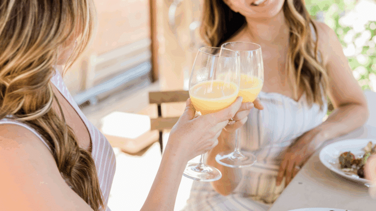 Two women toasting at a bridal brunch