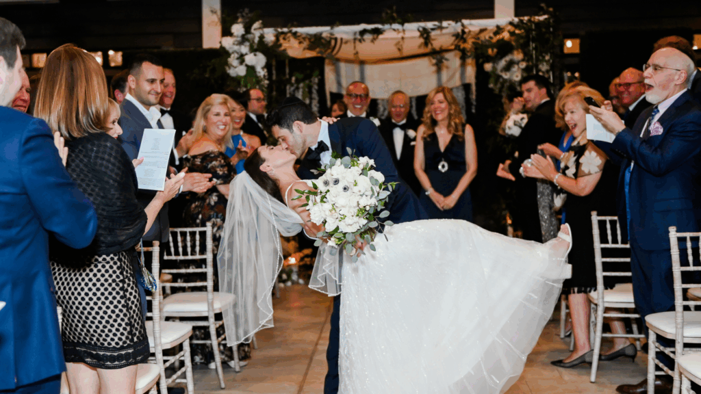 Bride and groom kissing at their winter wedding