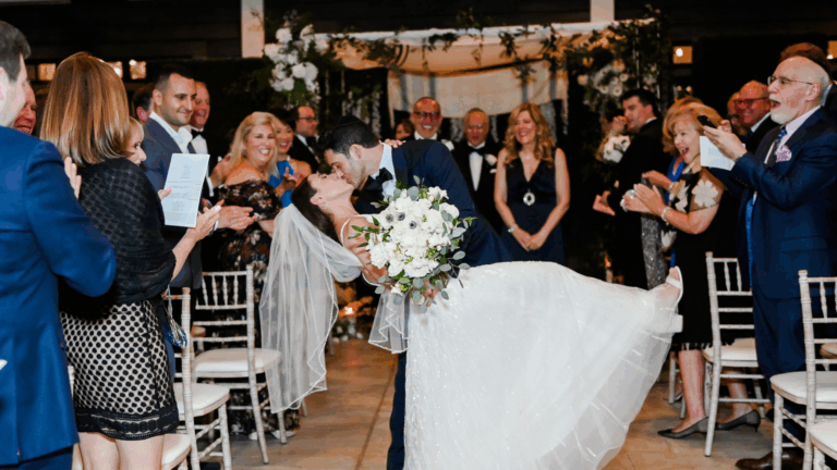 Bride and groom kissing at their winter wedding