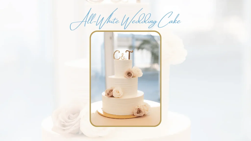 All-white wedding cake with rose accents